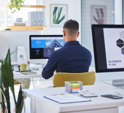 Designers working on UI/UX mockups for eCommerce platform